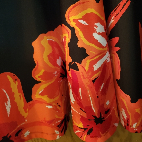 Very pretty black dress with orange/red floral pattern on the bottom. - Picture 5 of 6